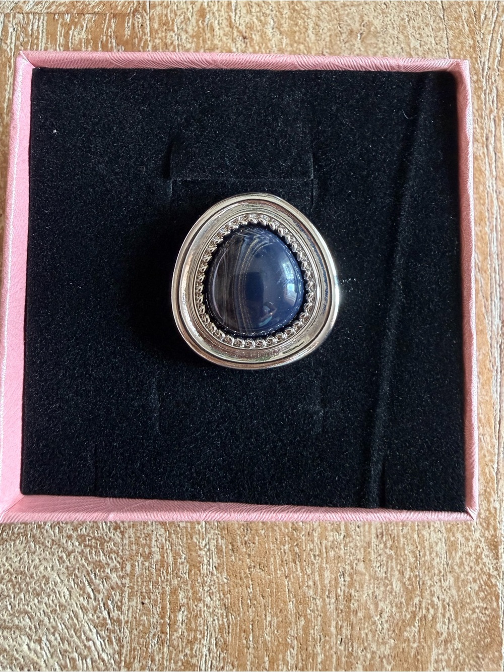 NWT Silver ring features a bold dark oval gemstone bordered braided design